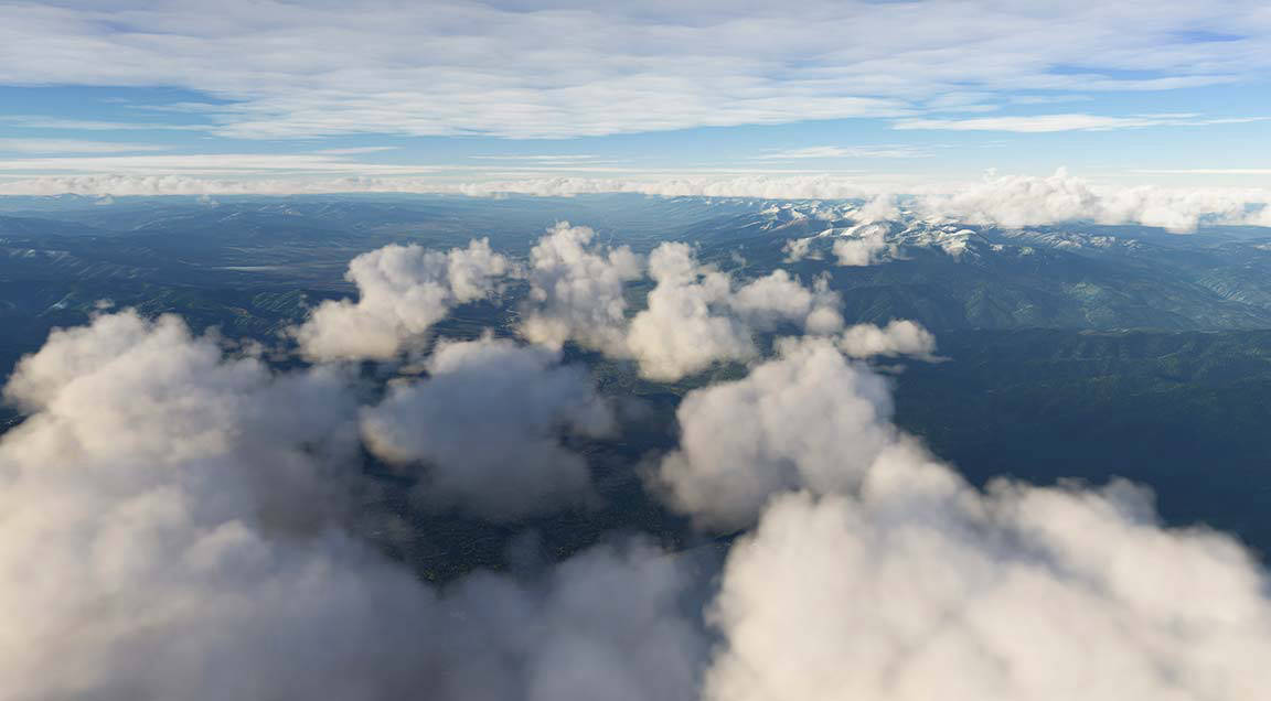 Clouds seen from above, as viewed from an airplane window.