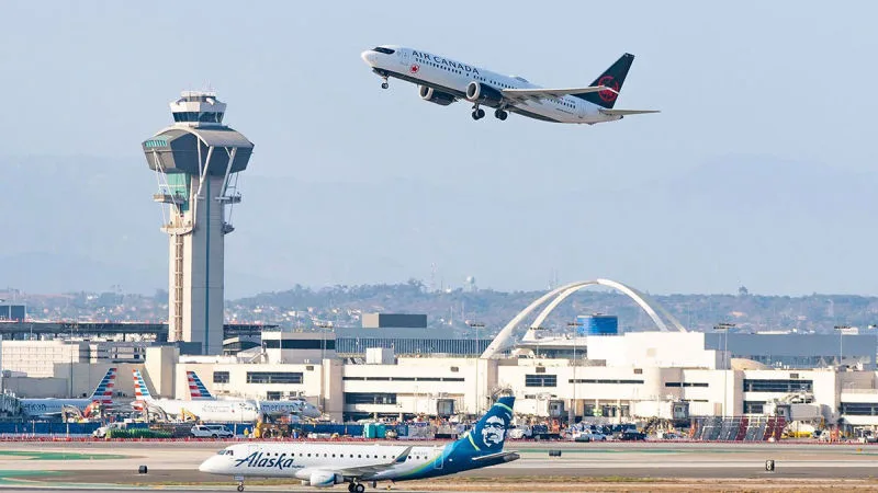 Air Canada Boeing 737 departing over Los Angeles International Airport (LAX) past the control tower, REX Atmos CORE in Microsoft Flight Simulator 2024