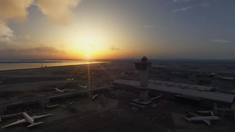 Aerial view of an airport and control tower at sunset, REX Atmos CORE in Microsoft Flight Simulator 2024