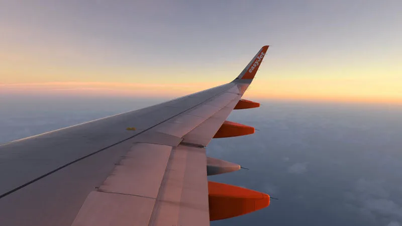 easyJet Airbus A320 wing above the clouds at sunset, REX Atmos CORE in Microsoft Flight Simulator 2024