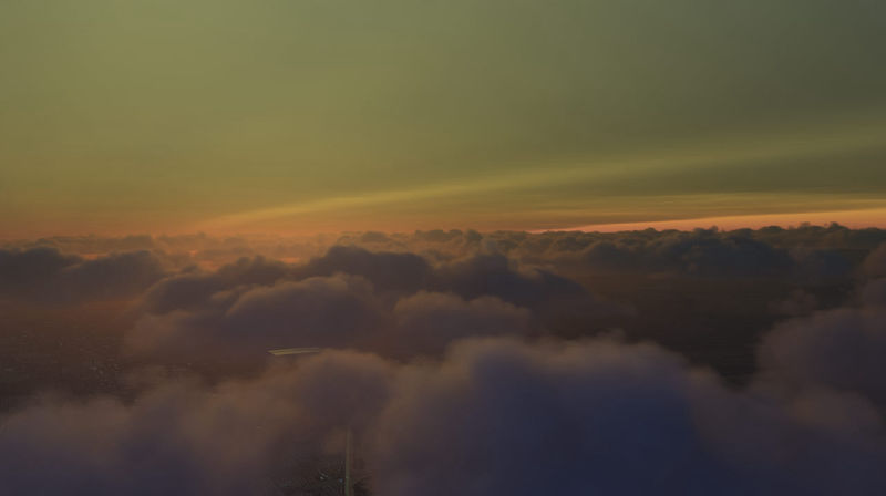 Above the clouds in an interesting colorful atmosphere