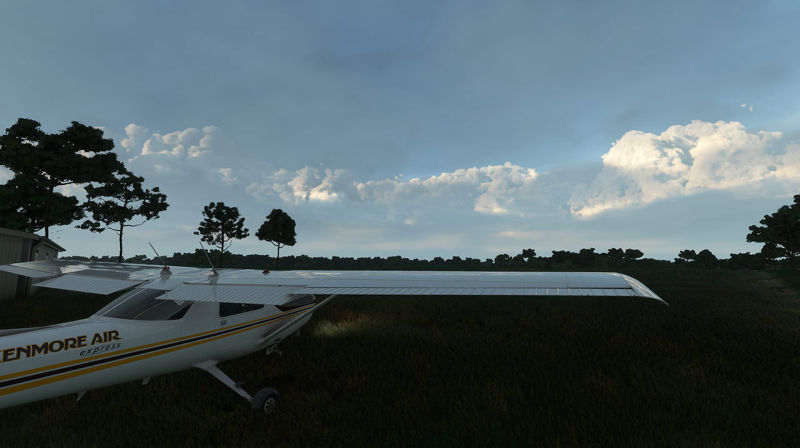 A plane parked on a private airfield